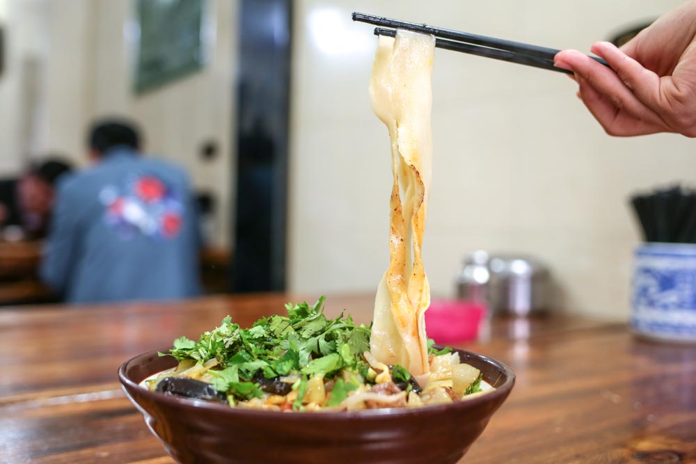 Biang Biang Noodles Being Picked Up By Chopsticks