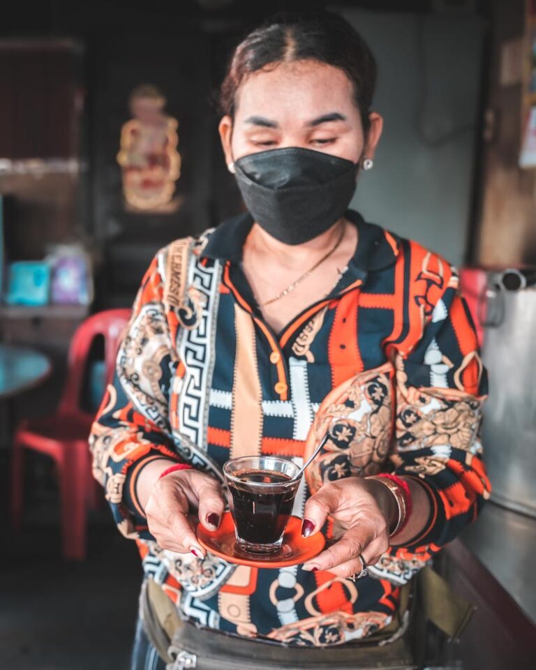 Woman holding Khmer coffee