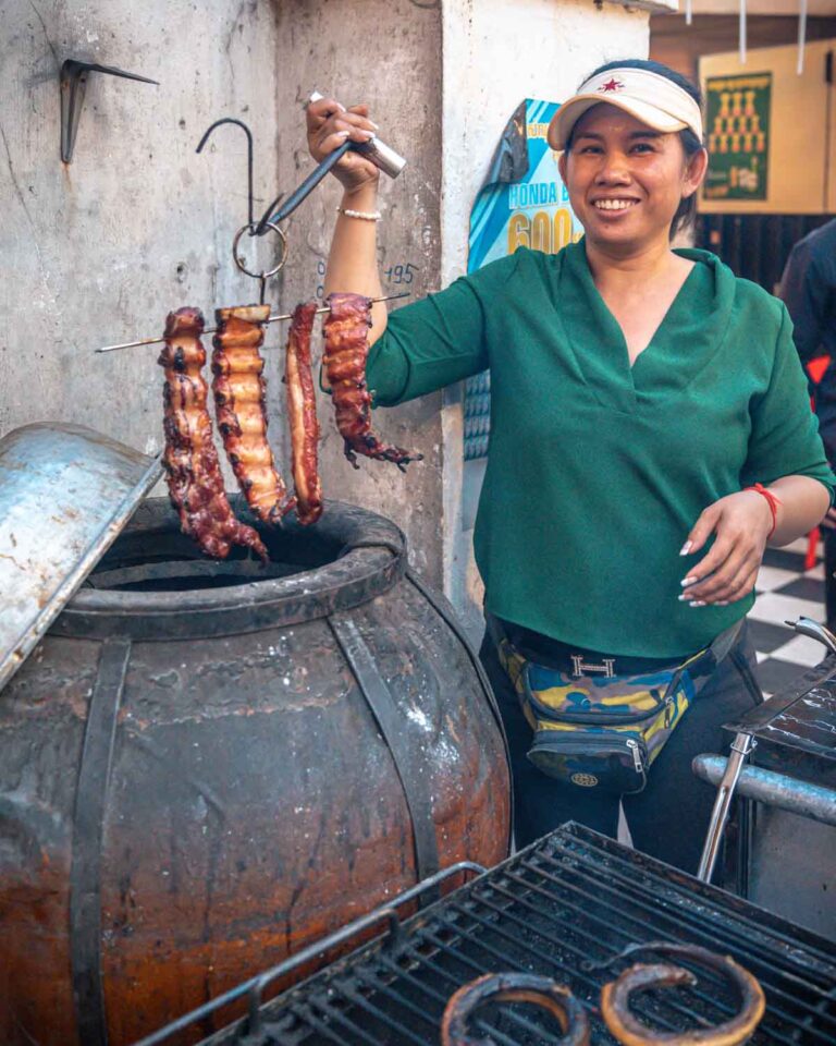 Person cooking Khmer barbecue ribs