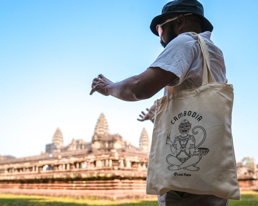 Tour Guide Explaining Angkor Wat