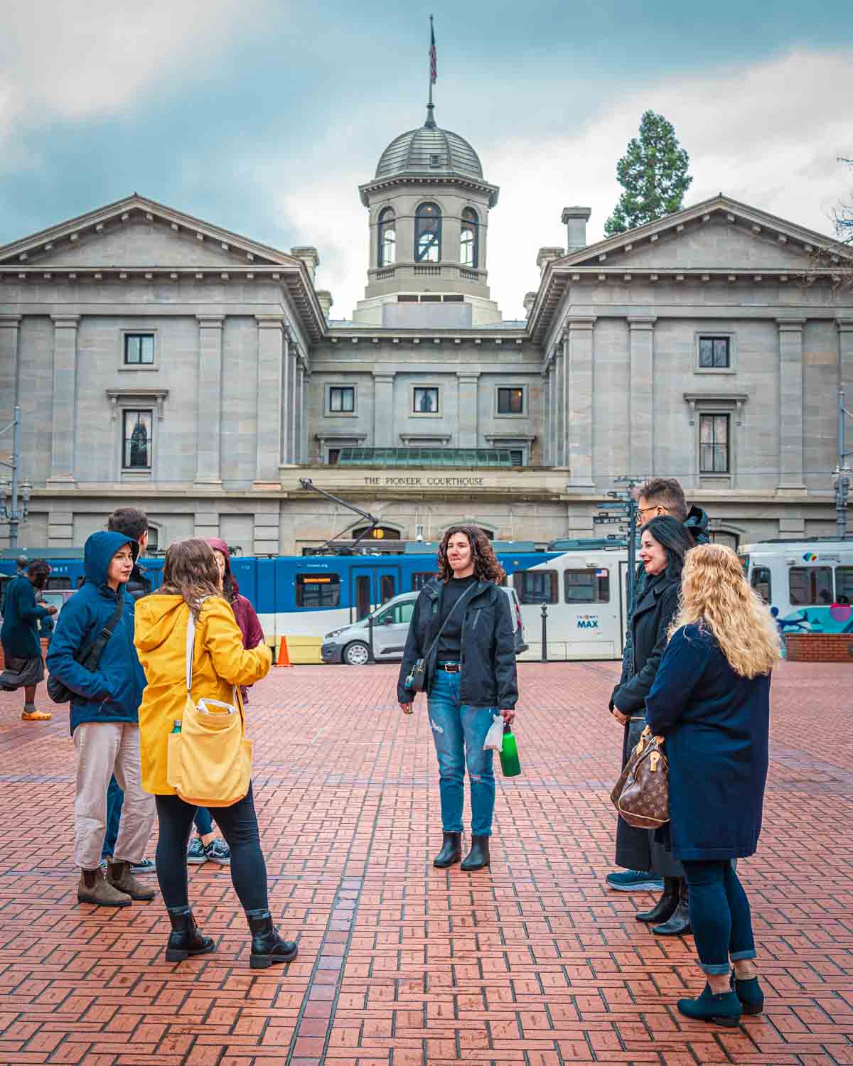Walking tour group in front of Pioneer Courthouse