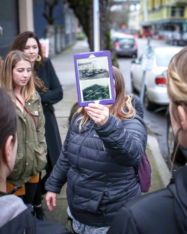 Tour guest holding a pamphlet