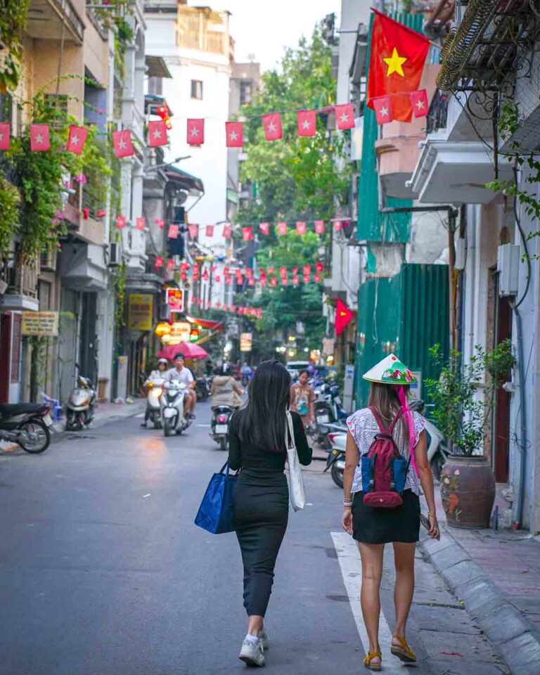 Tourists in a Hanoi alley