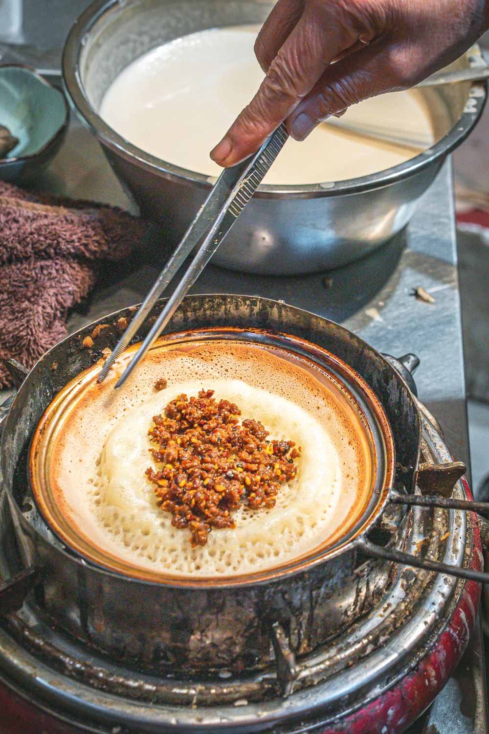 Chengdu pancake being made in a pan