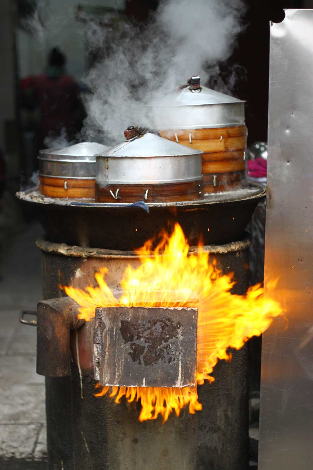 Flames steaming dumpling baskets