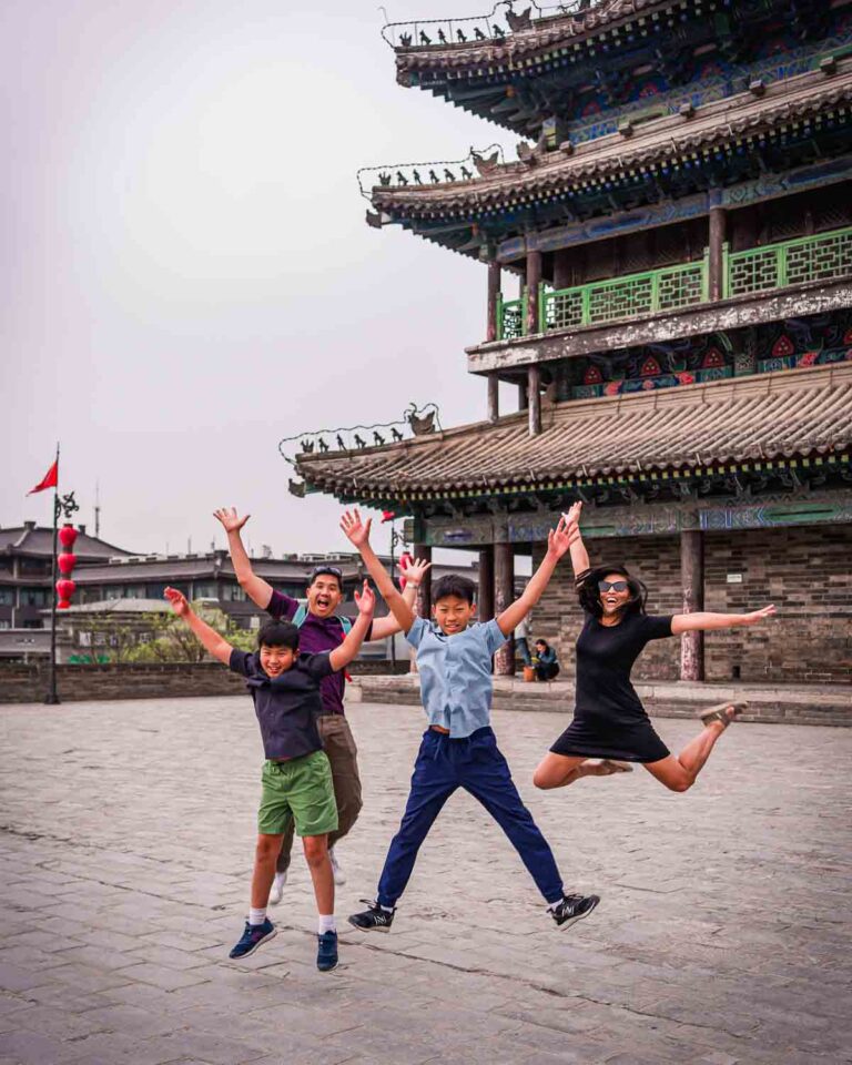 Guests jumping at a Xian wall tower