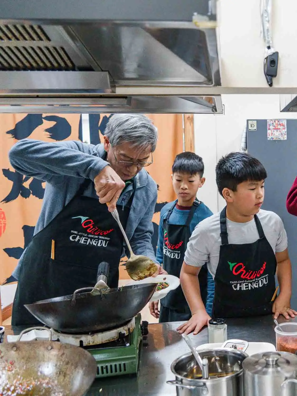 Grandpa and grandchildren in a cooking class