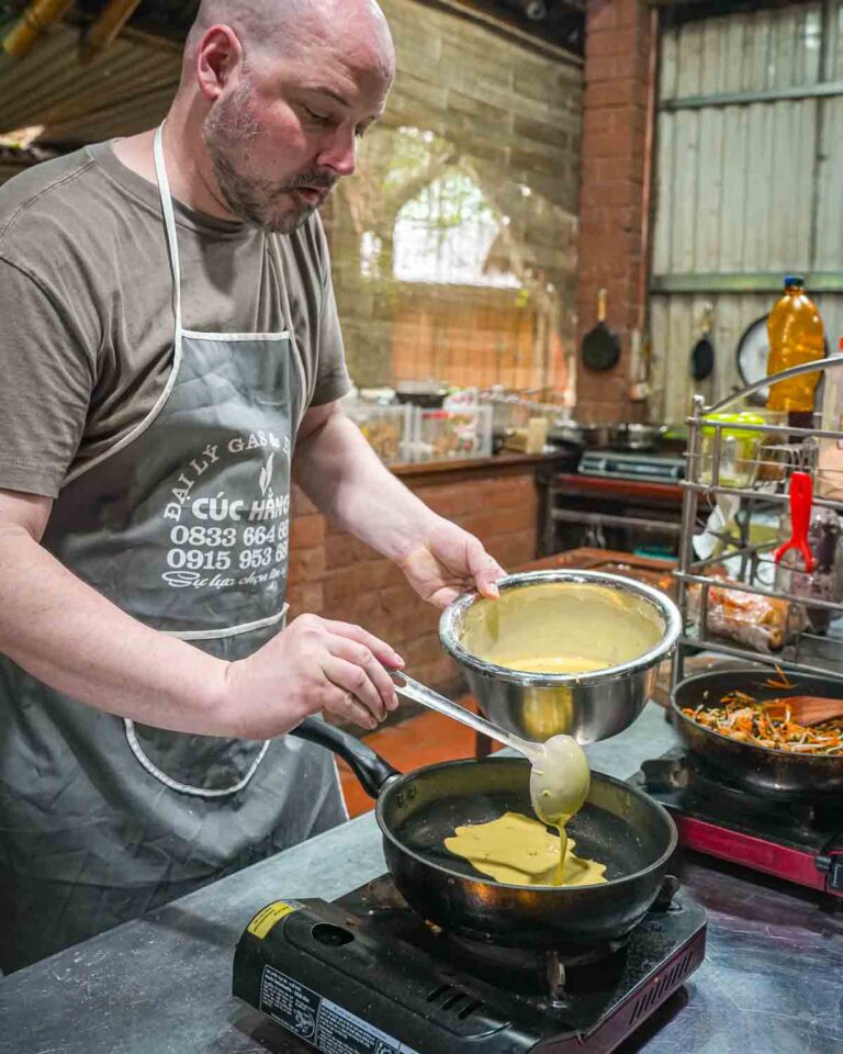 Guest pouring batter in cooking class