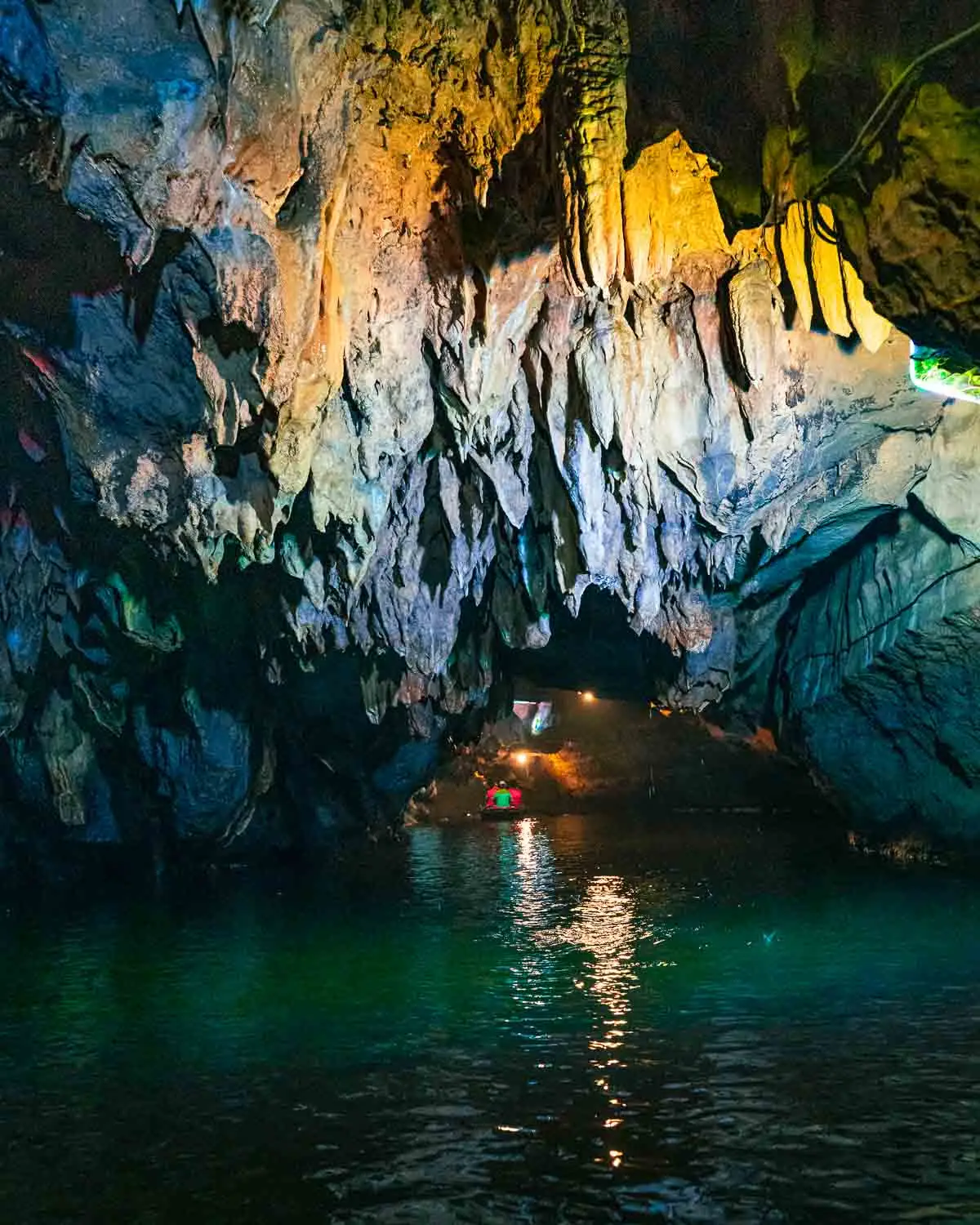 Boating through a cave with rock formations