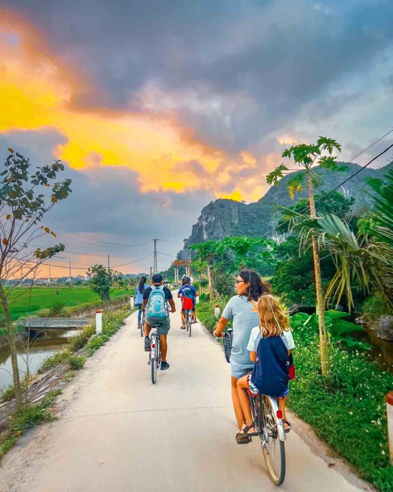 Guests cycling at sunset