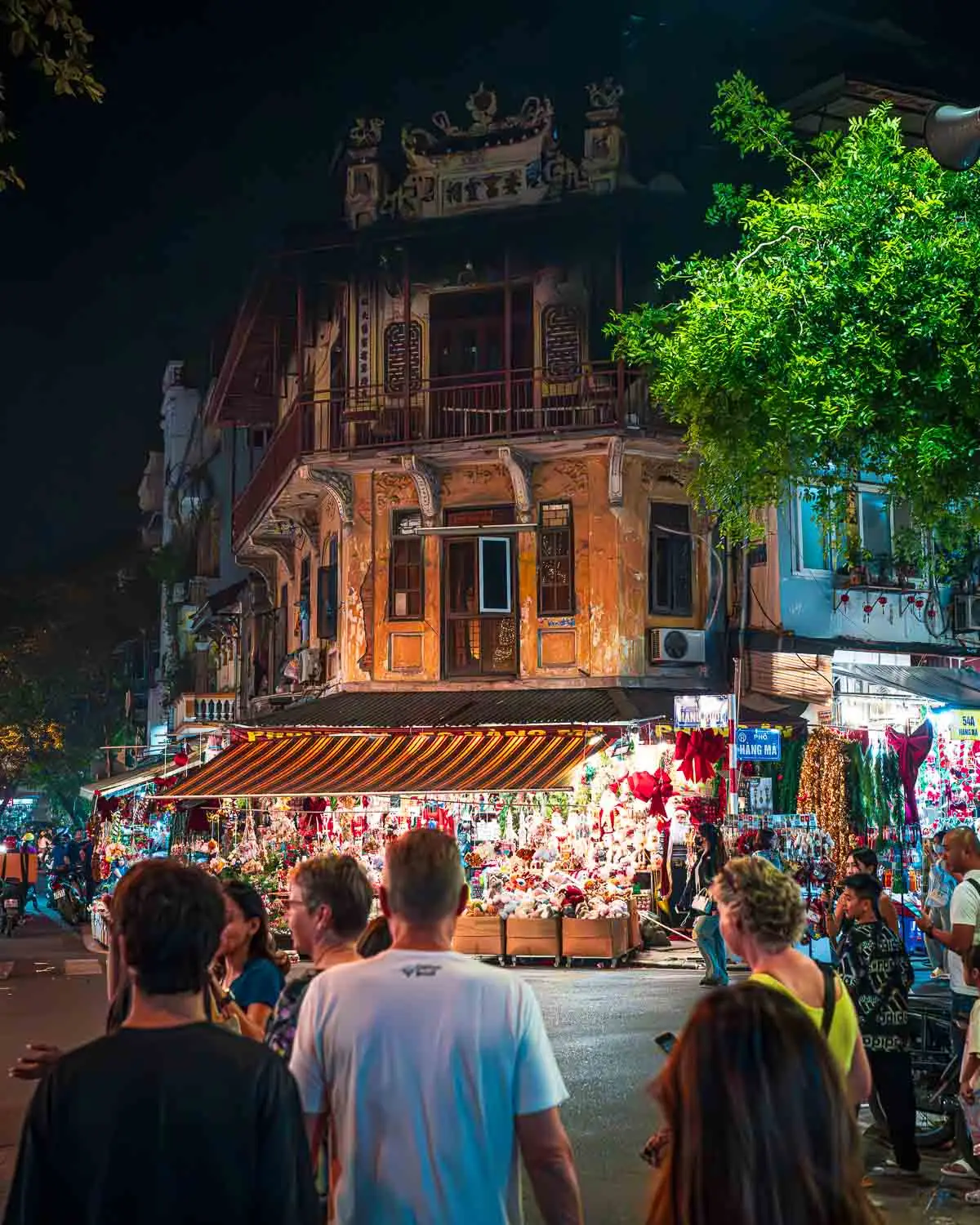 Guests walking through Hanoi Old-quarter