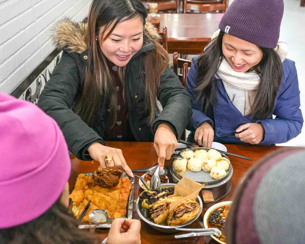Tour guests digging into food