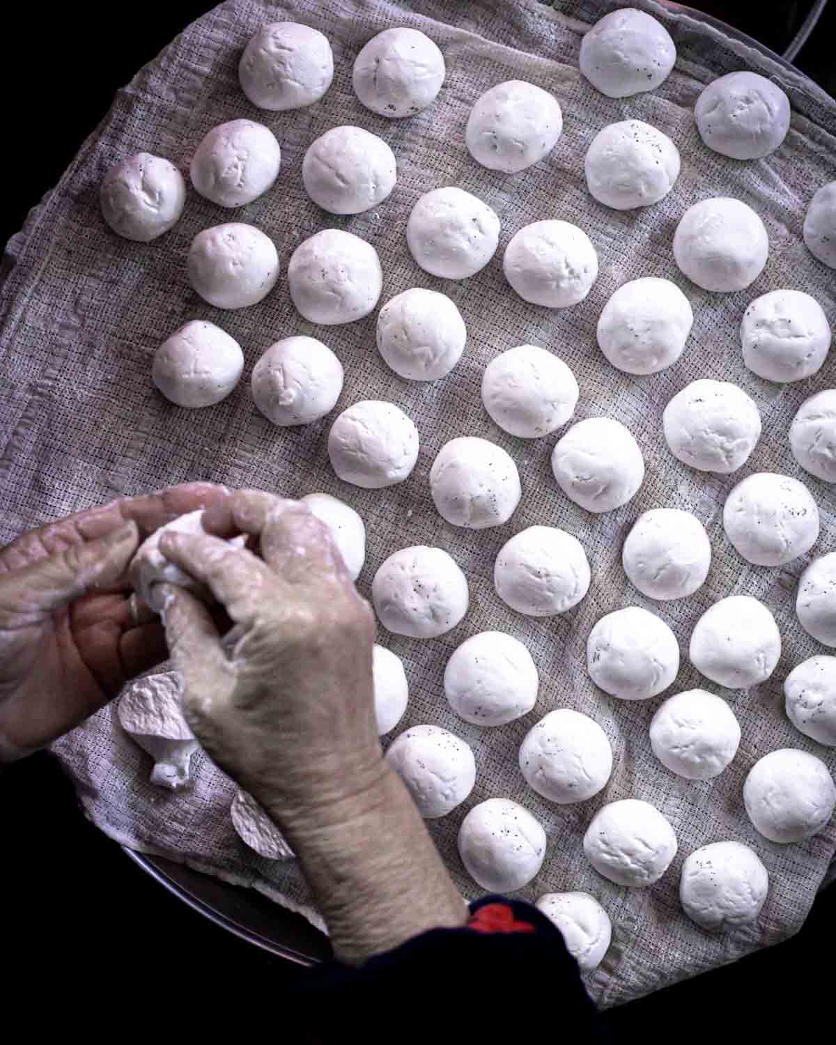 Vendor making treats by hand