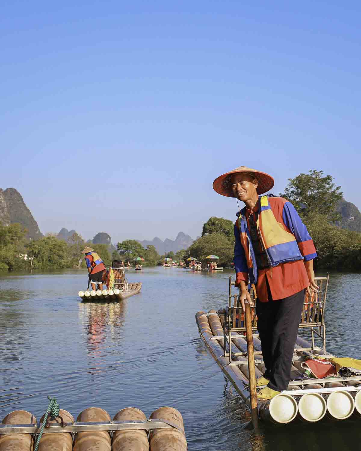 Local on bamboo boat