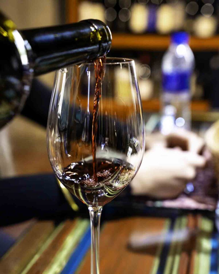 Pouring a glass of red wine