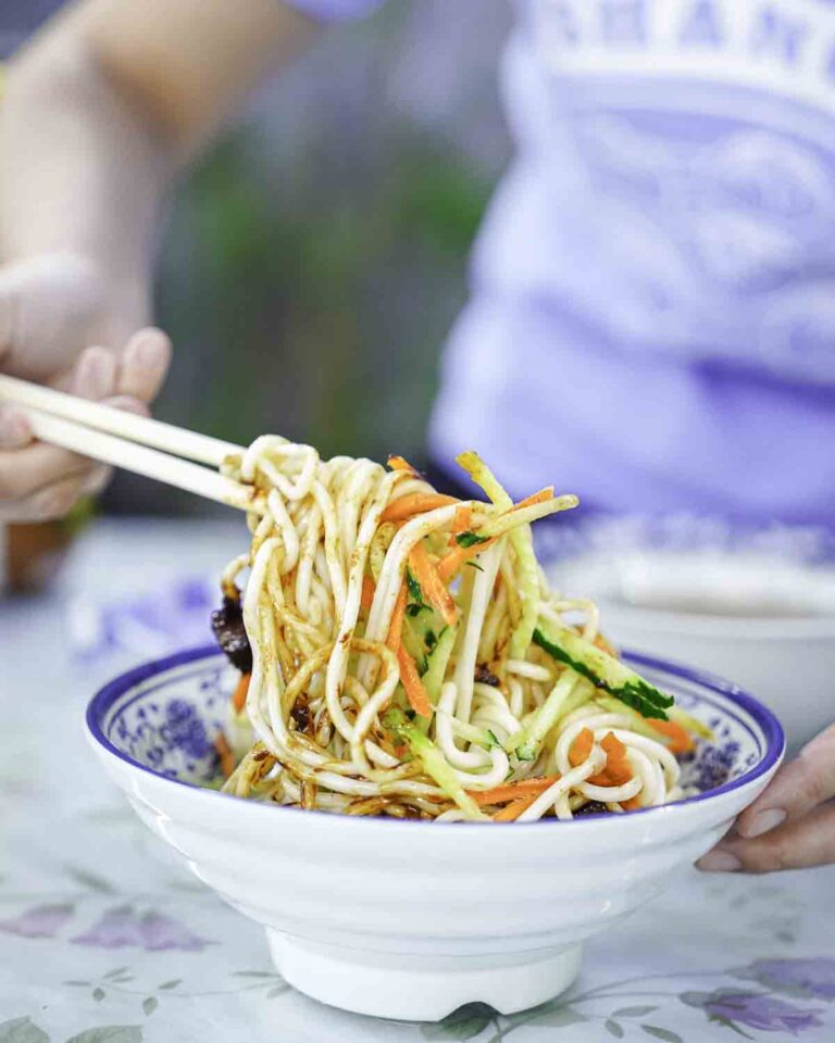 Guest eating local noodles