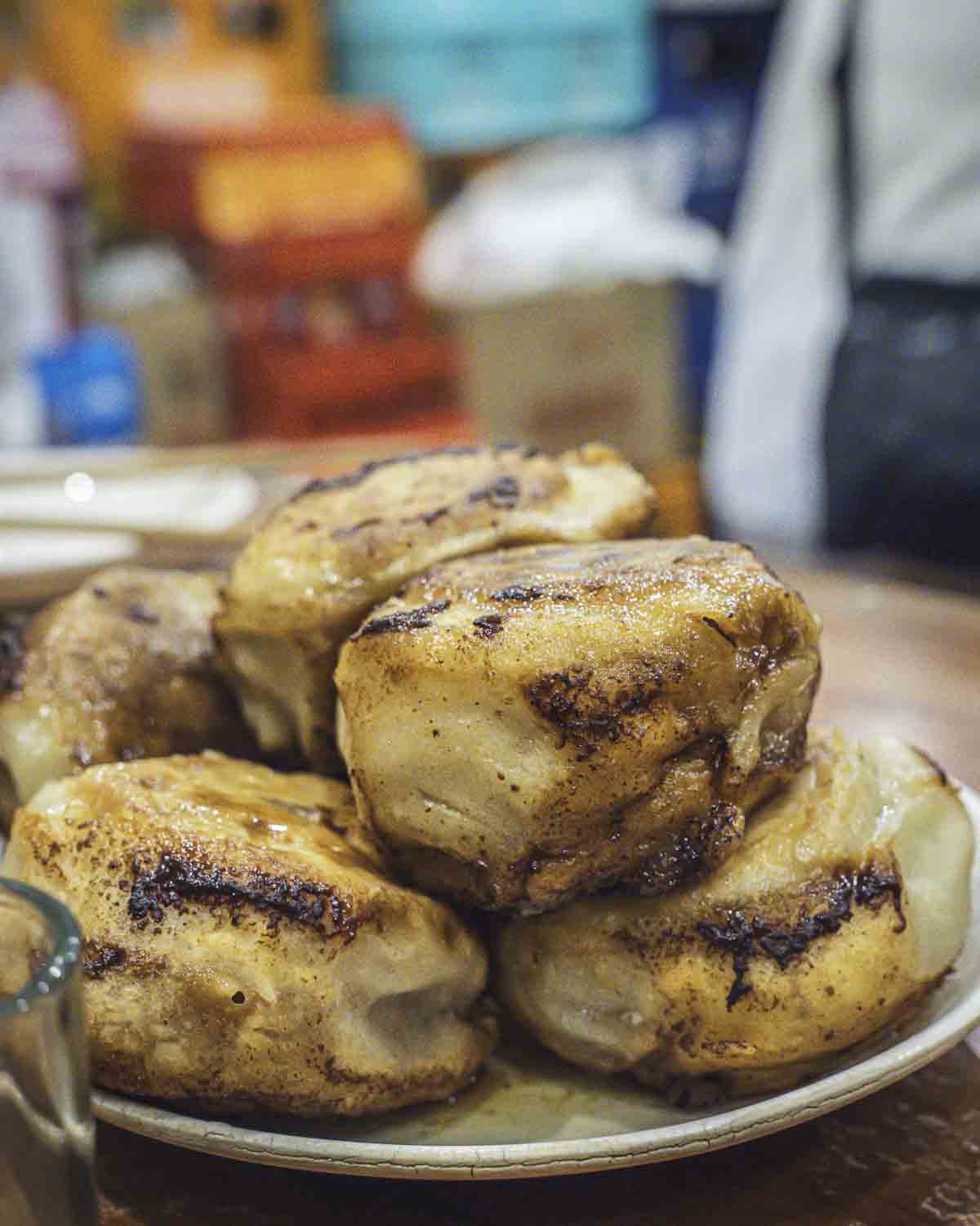 Plate piled with meat buns