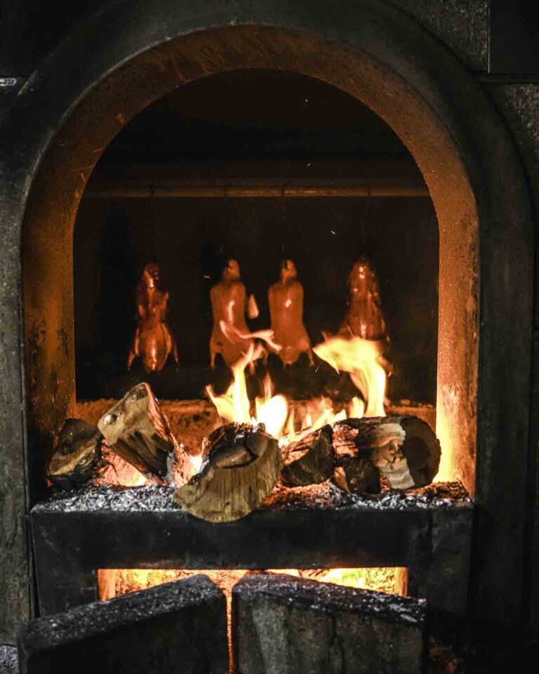 Peking duck roasting over fire