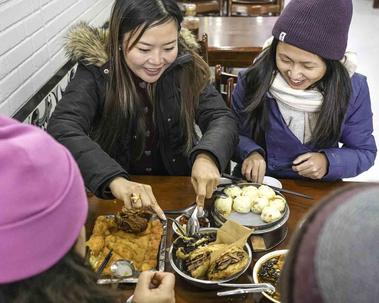 Happy eaters eating breakfast