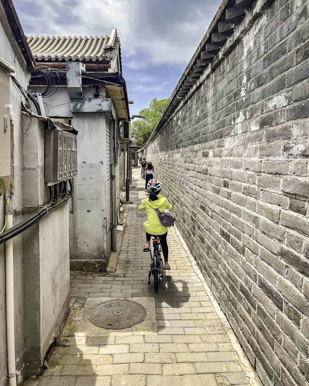 Ebiker riding through a narrow alleyway