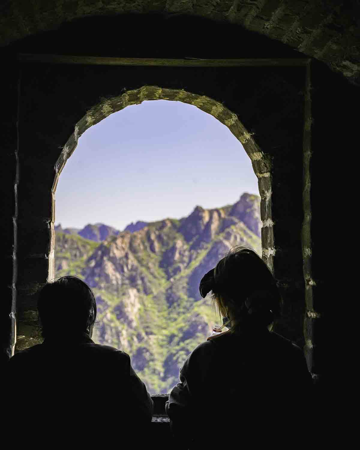 Couple looking out a watchtower window