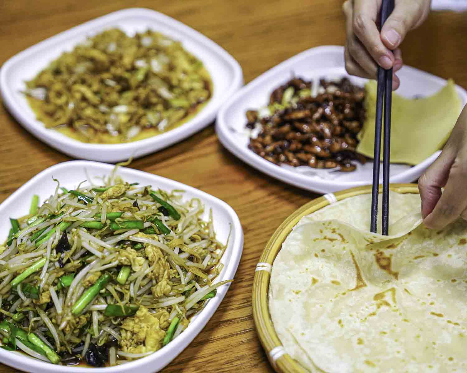 Table with spring pancakes and dishes