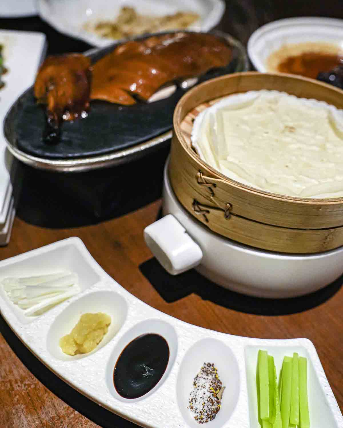 Table with Peking duck and sides