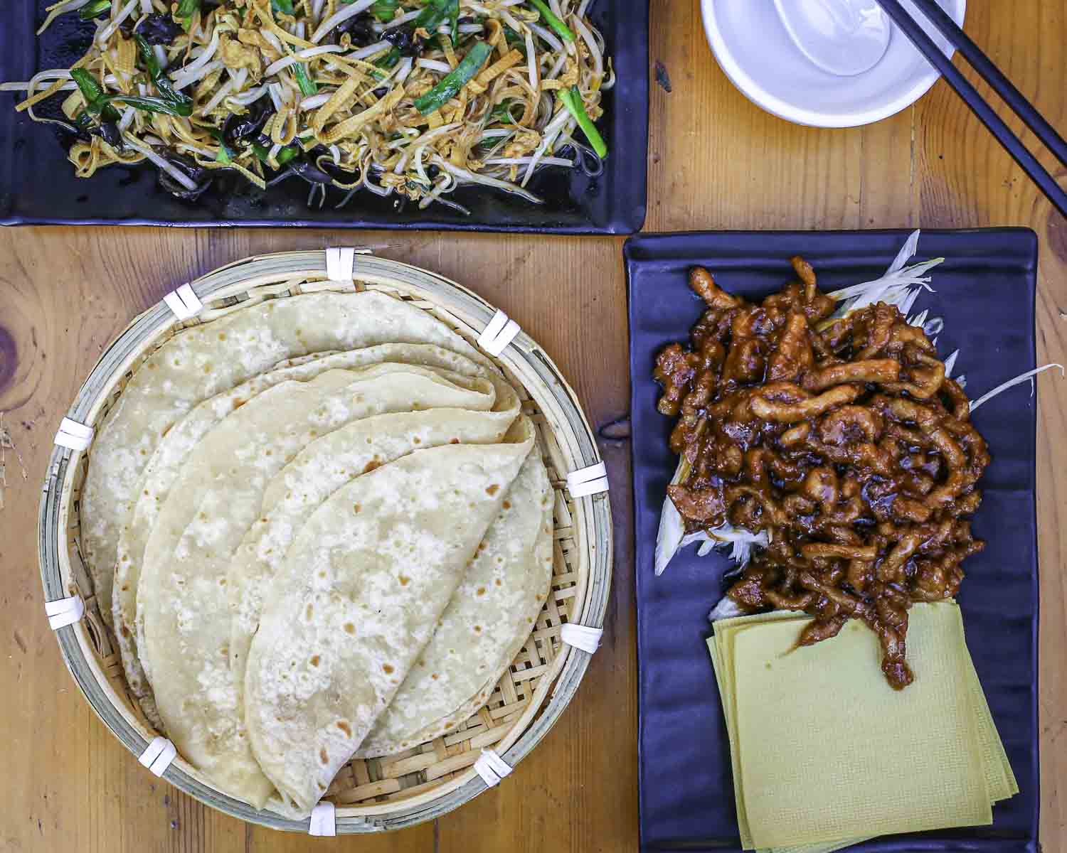 Table with spring pancakes and dishes