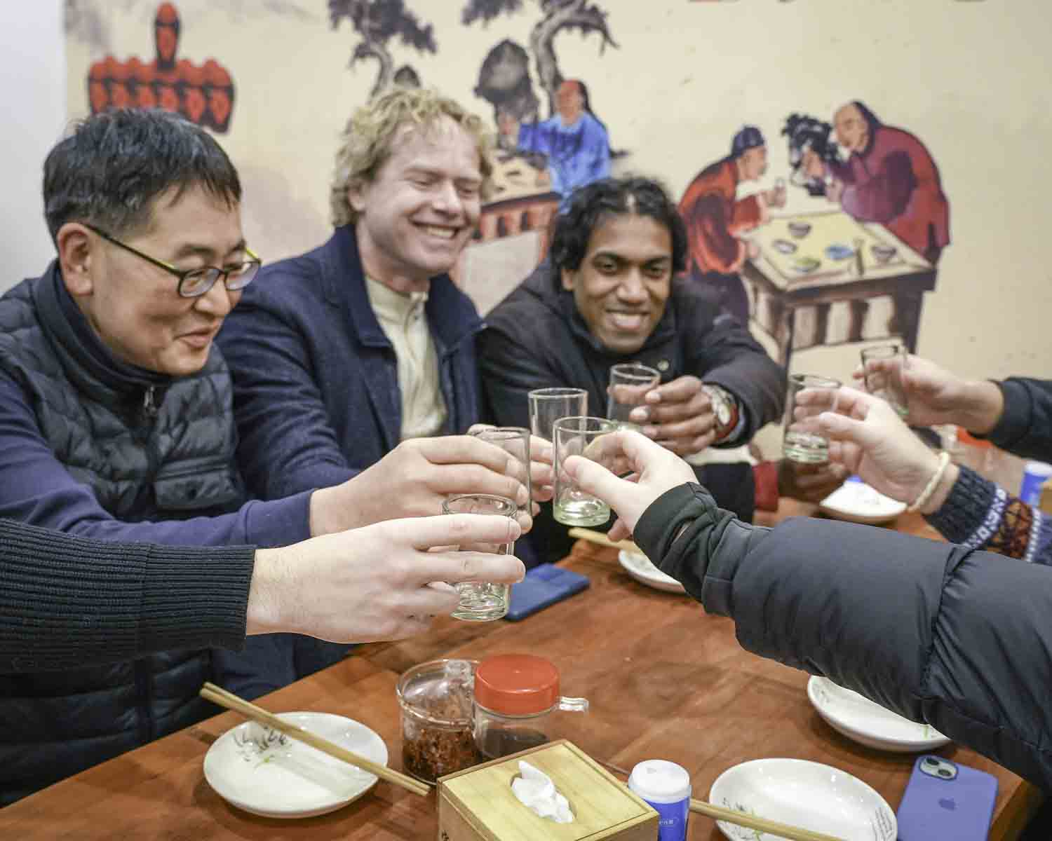 Guest cheers at table