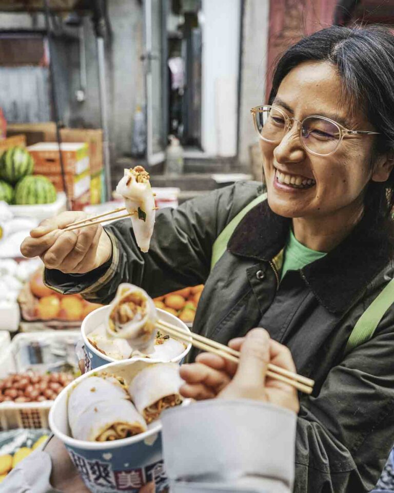 Happy eaters eating rice noodle rolls