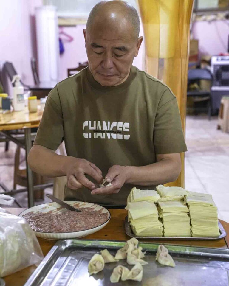Vendor hand-making dumplings