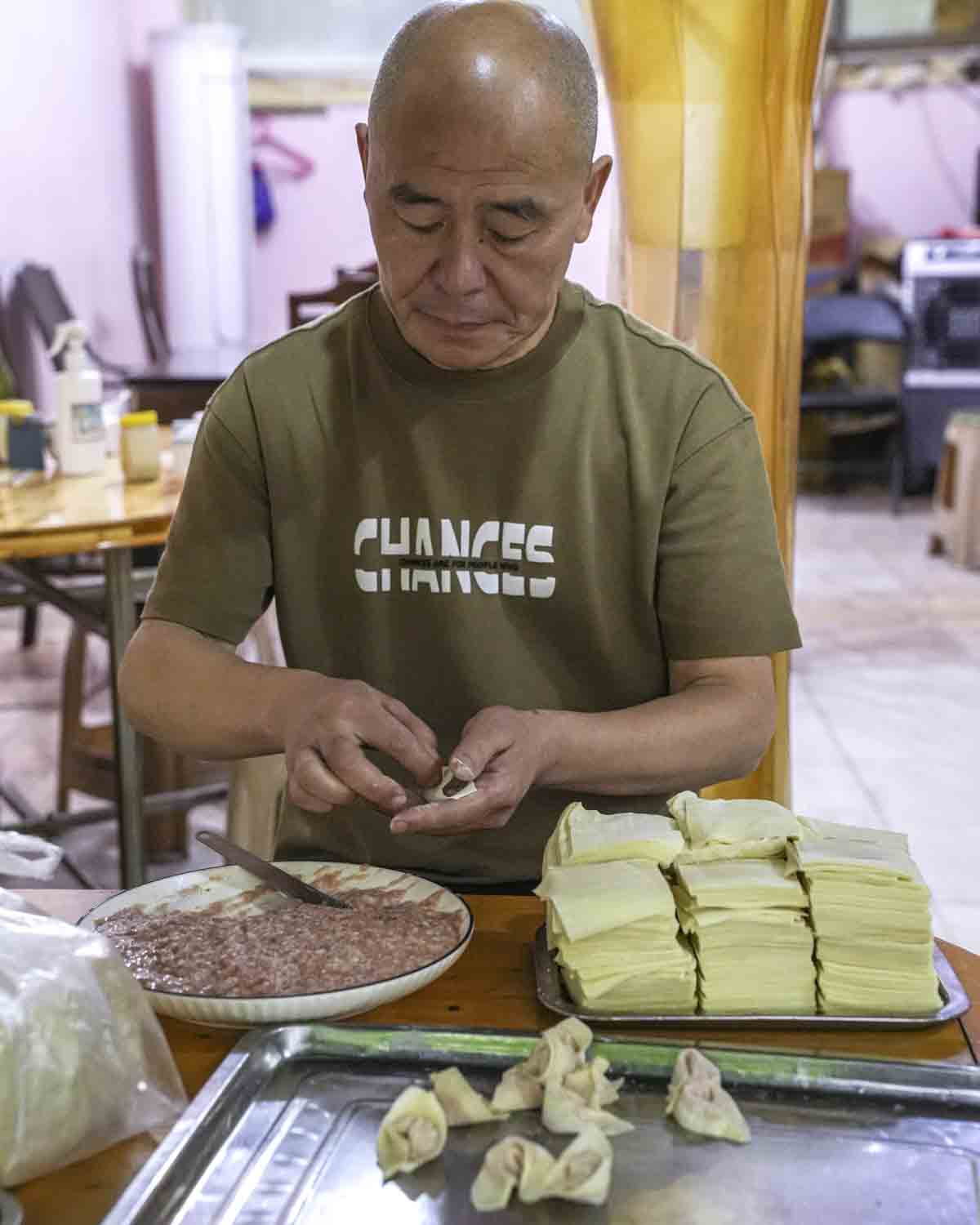 Vendor hand-making dumplings