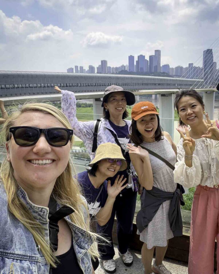 Group photo with daytime skyline