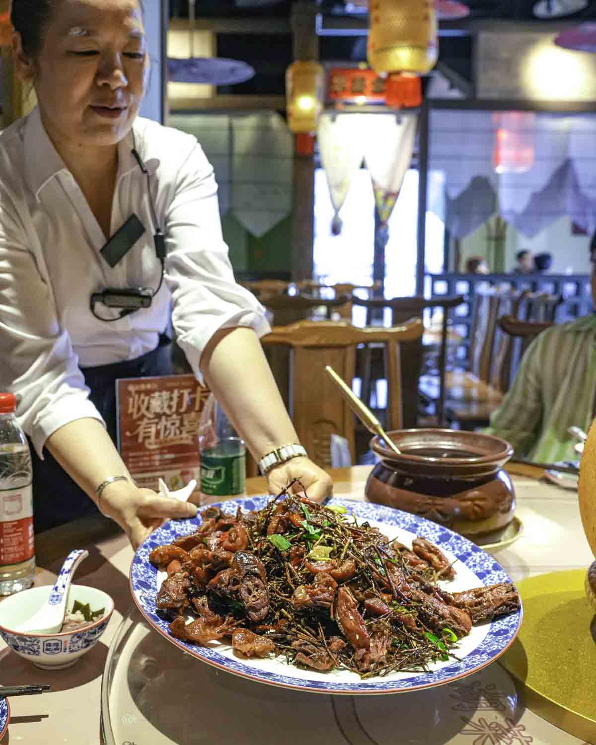 Waitress serving giant plate for lunch
