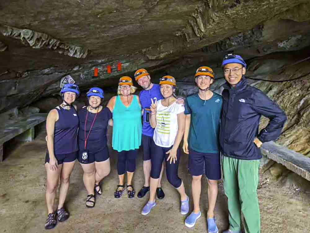 Group shot in front of cave