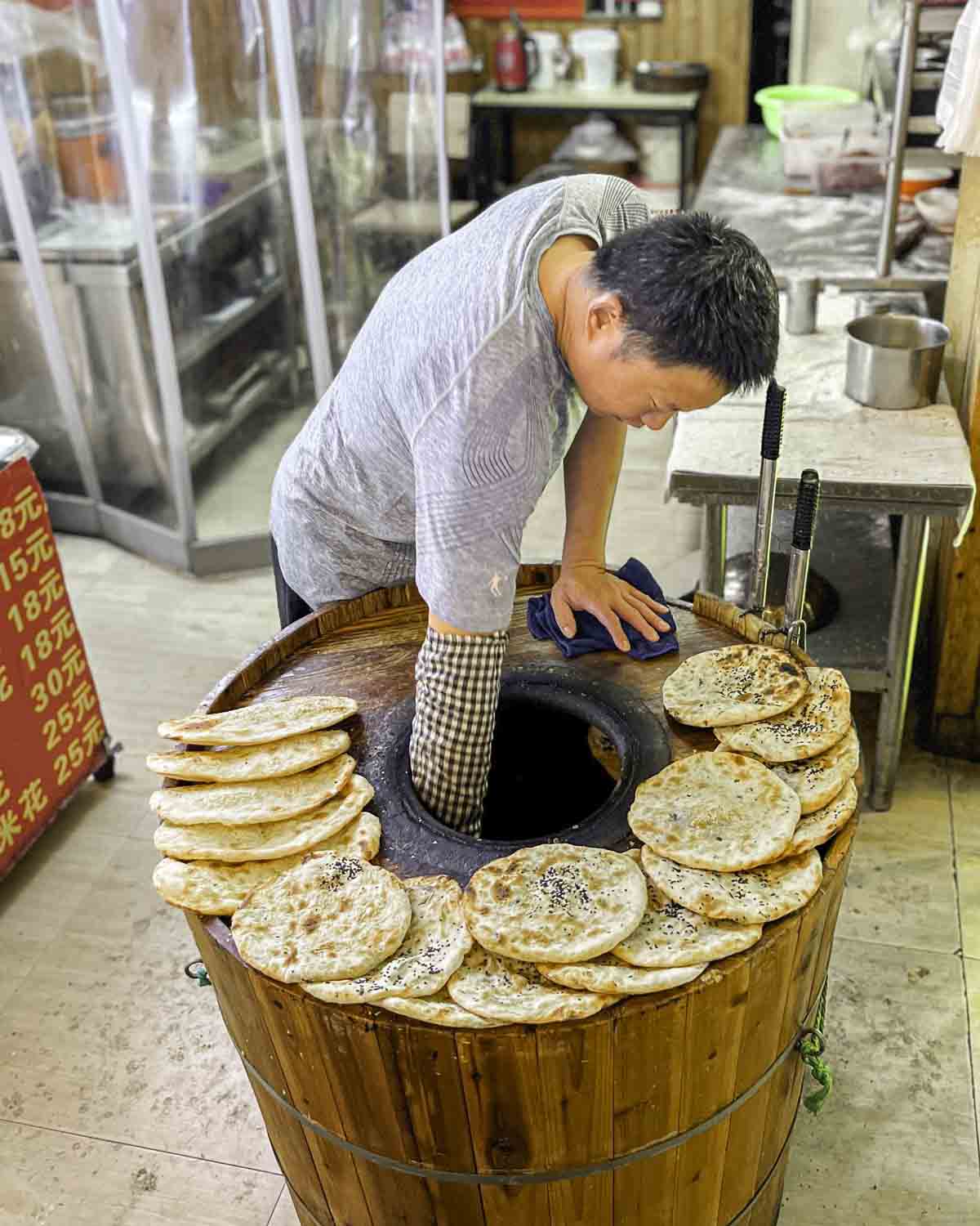 Vendor making local bread