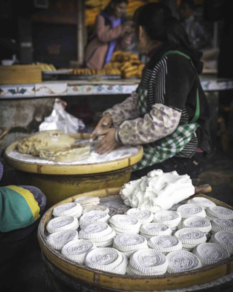 Vendors making snacks at market