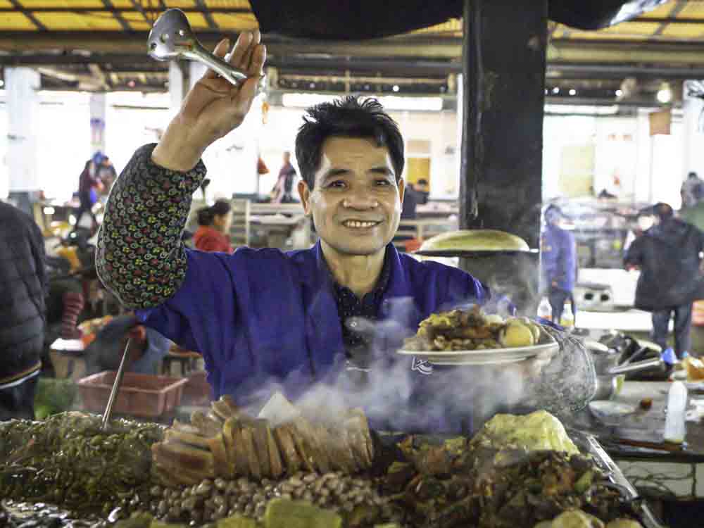 Smiling vendor at market